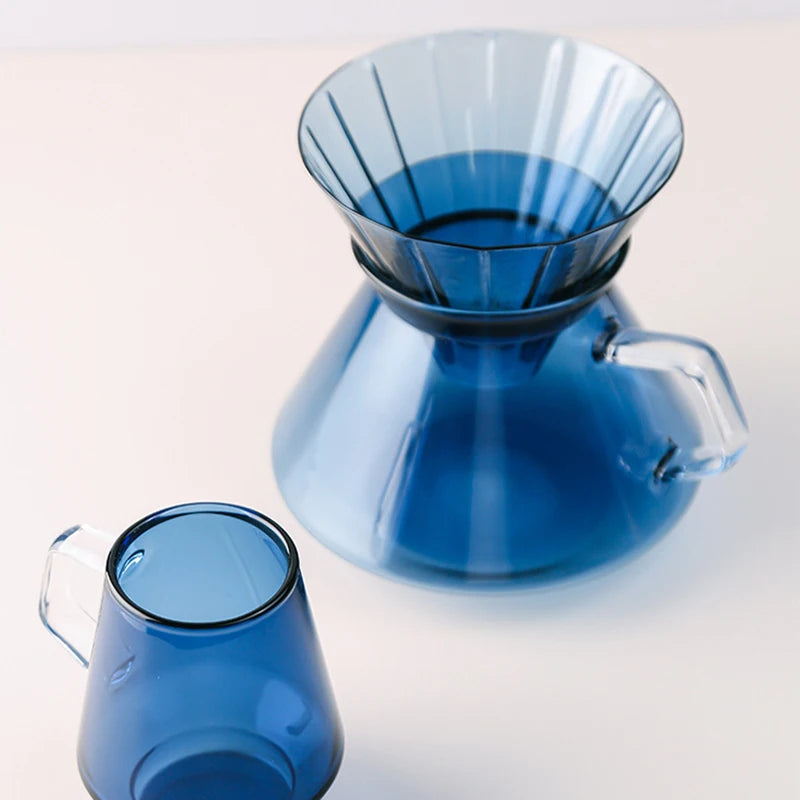 Tanooki Beans blue coffee cups and carafe showcasing how much caffeine is in a cup of coffee