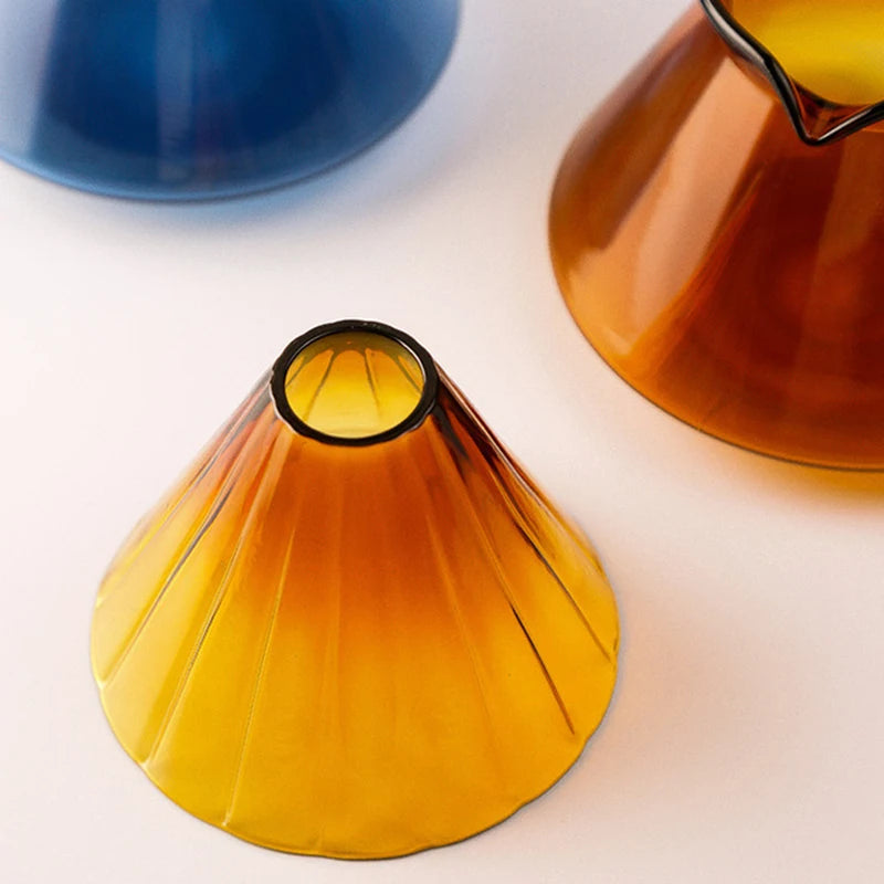 Colorful Tanooki Beans coffee cups with unique designs exploring how much caffeine is in a cup of coffee