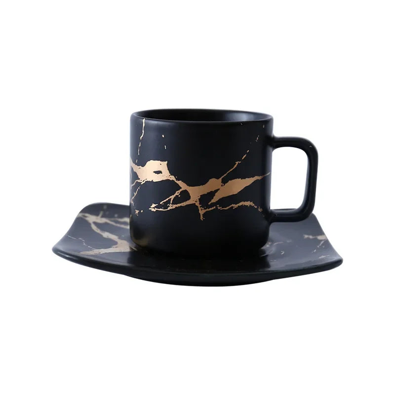 Stylish black coffee mug about coffee with gold accent design, includes matching saucer