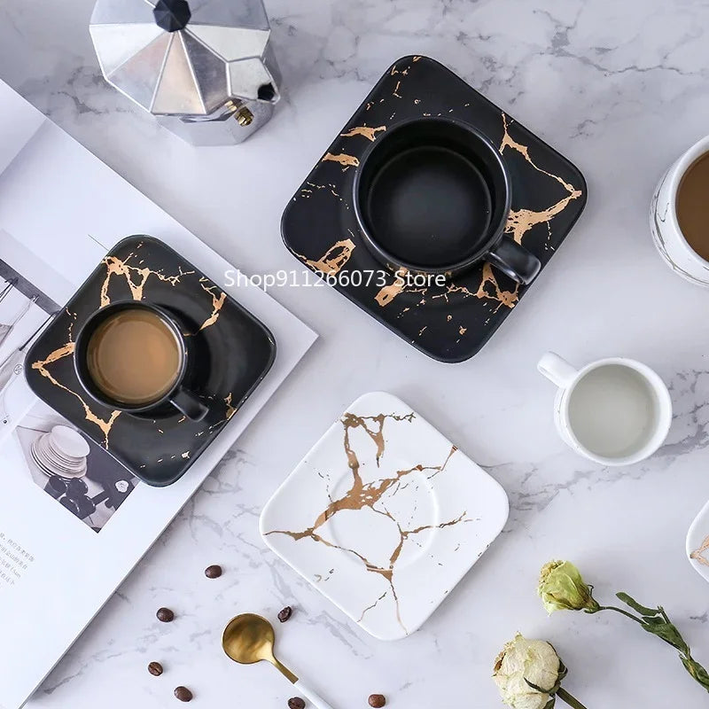 Elegant Tanooki Beans mugs about coffee with stylish gold marbling design on matching saucers